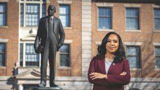 Chancellor Dixon standing by Dr. Shephard Statue